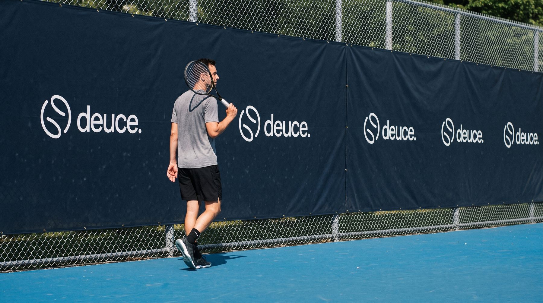 Court windscreen printed with the deuce logo